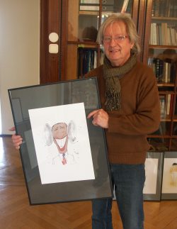 Werner Rollow mit Obama-Karikatur. Foto: Karsten Pietsch
