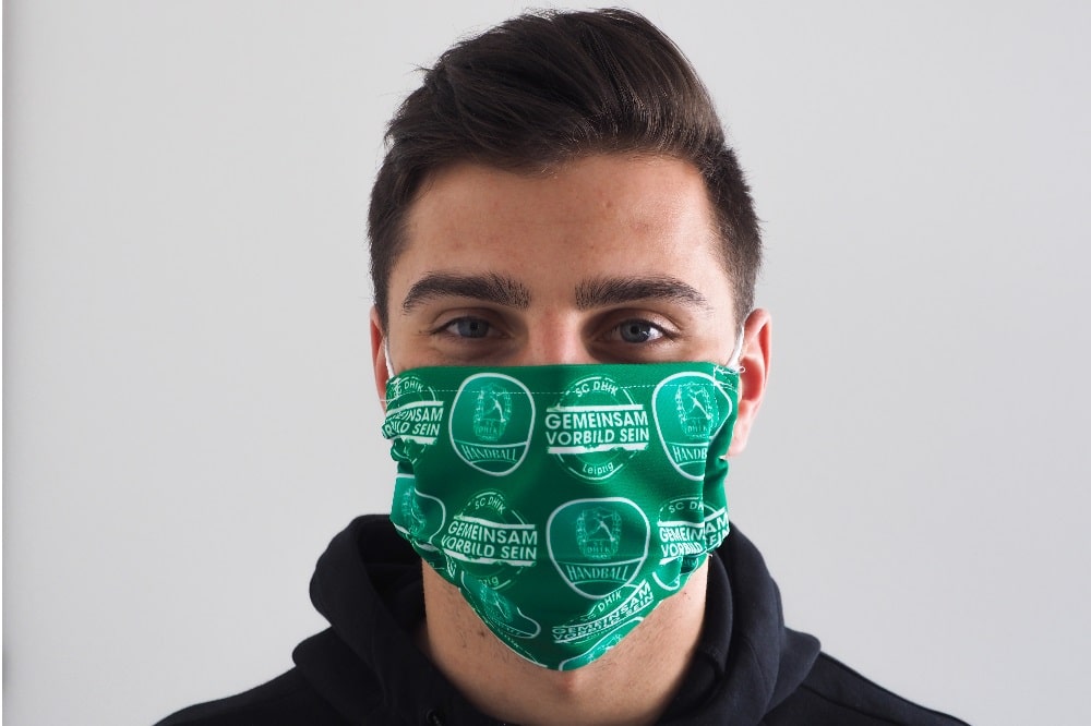 Rechtsaußen Lucas Krzikalla mit einer SC DHfK Gesichtsmaske. Quelle: SC DHfK