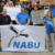 NABU-Protest mit Transparent.