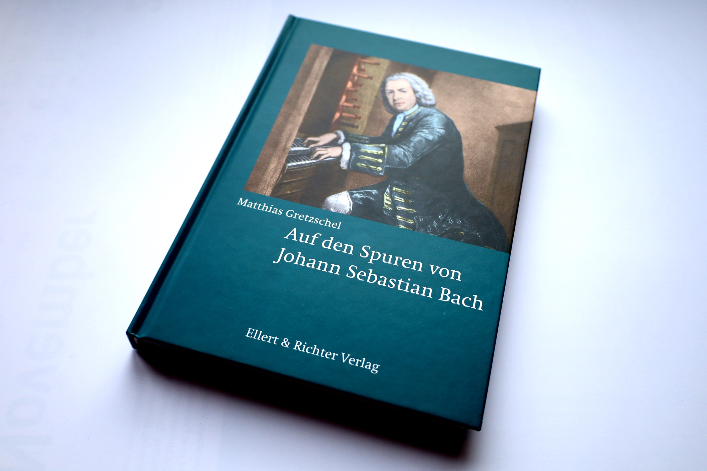 Buchcover, Titelbild mit Bach.